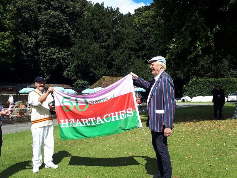 A person holding a flag
Description automatically generated